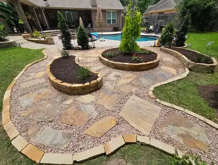 Flagstone patio with raised planter beds