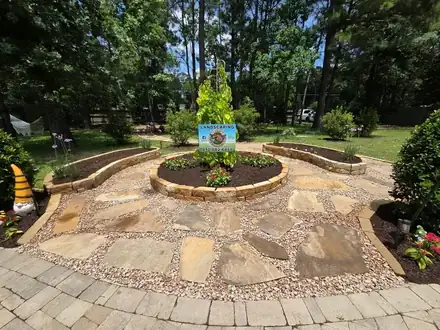 Flagstone patio with raised planter beds (photo 6 of 8)