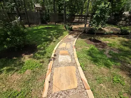 Flagstone seating area and path under trees (photo 2 of 2)